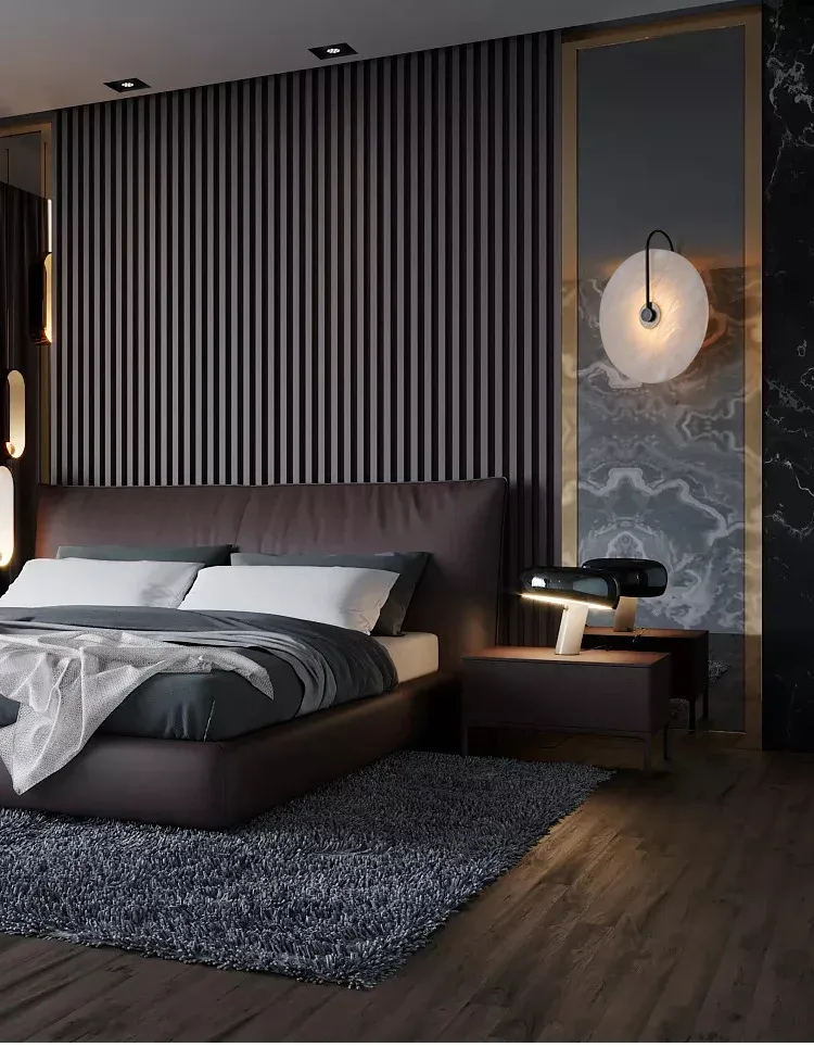 מנורת קיר עגולה ליד מיטה בחדר מודרני